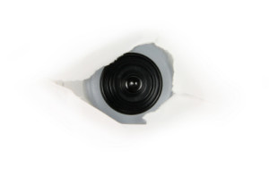 eye of spy, web cam behind a paper hole